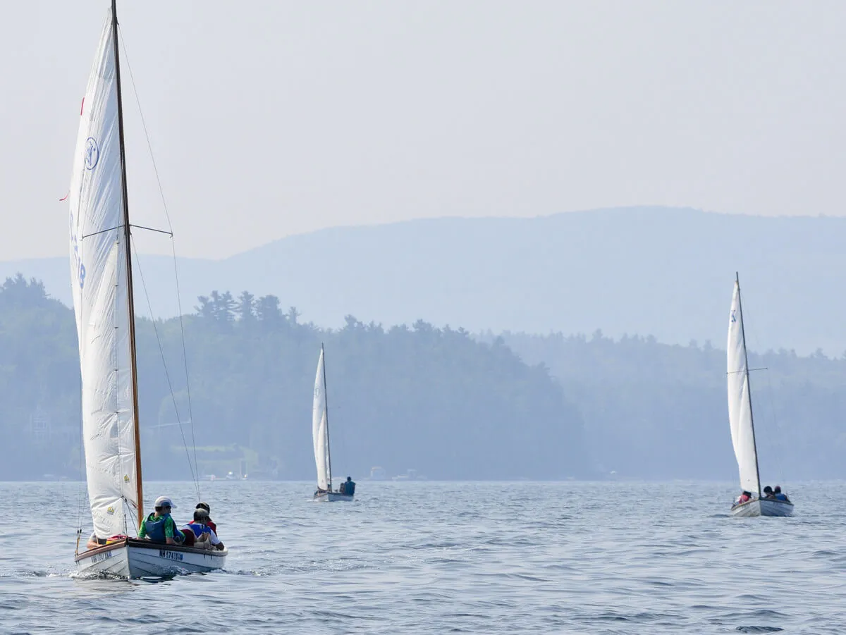 Groups of boys sailing on Lake Winnipesaukee