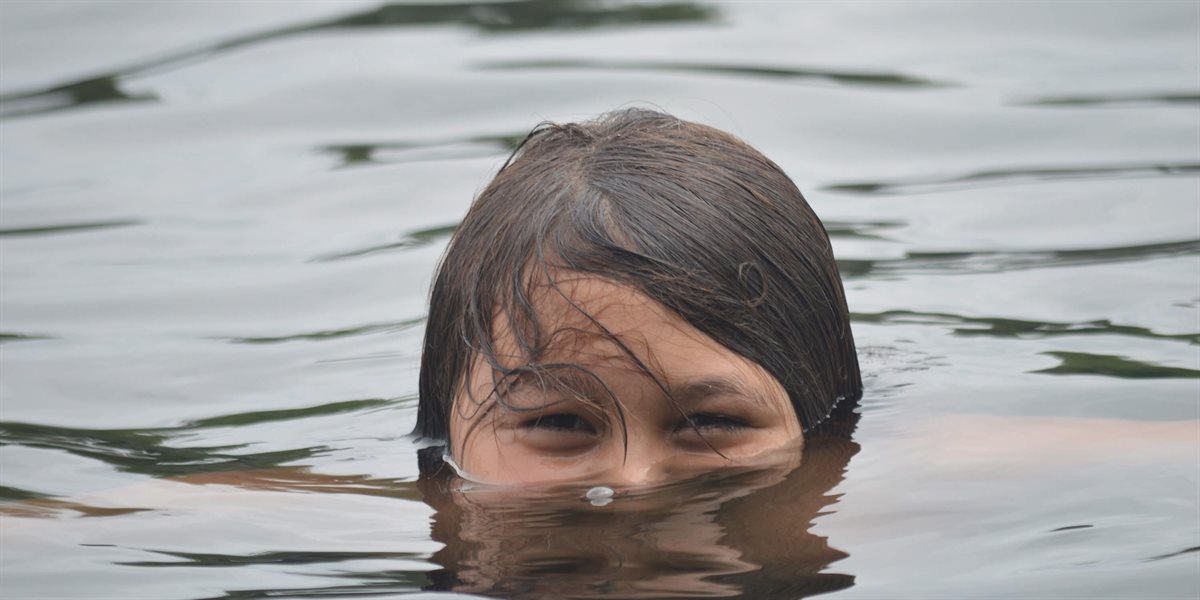 Boy swimming in Lake Winnipesaukee