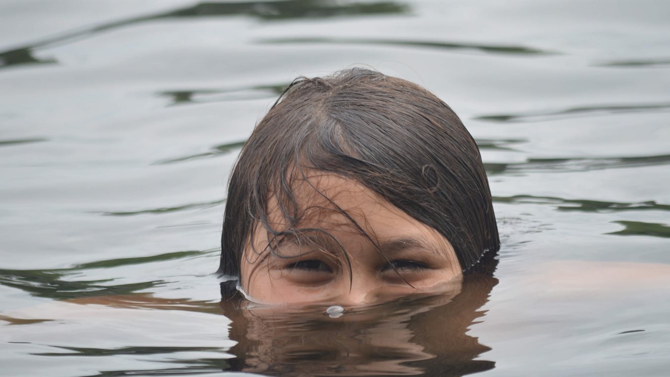 Boy swimming in Lake Winnipesaukee