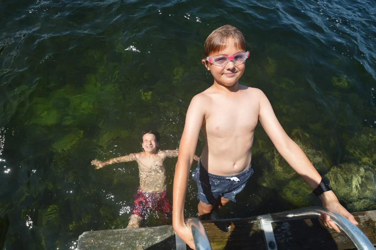 Two boys swimming in Lake Winnipesaukee