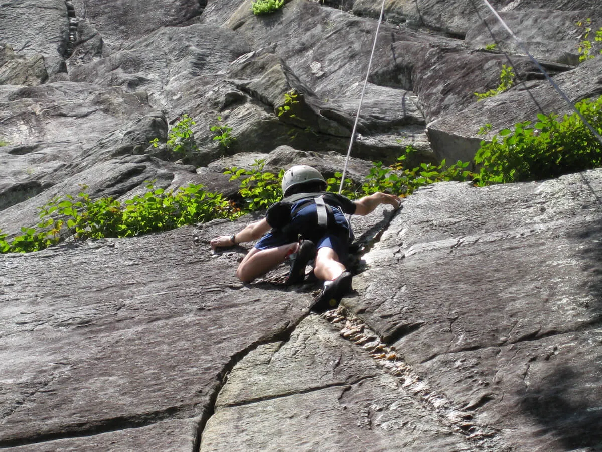 Boy rock climbing